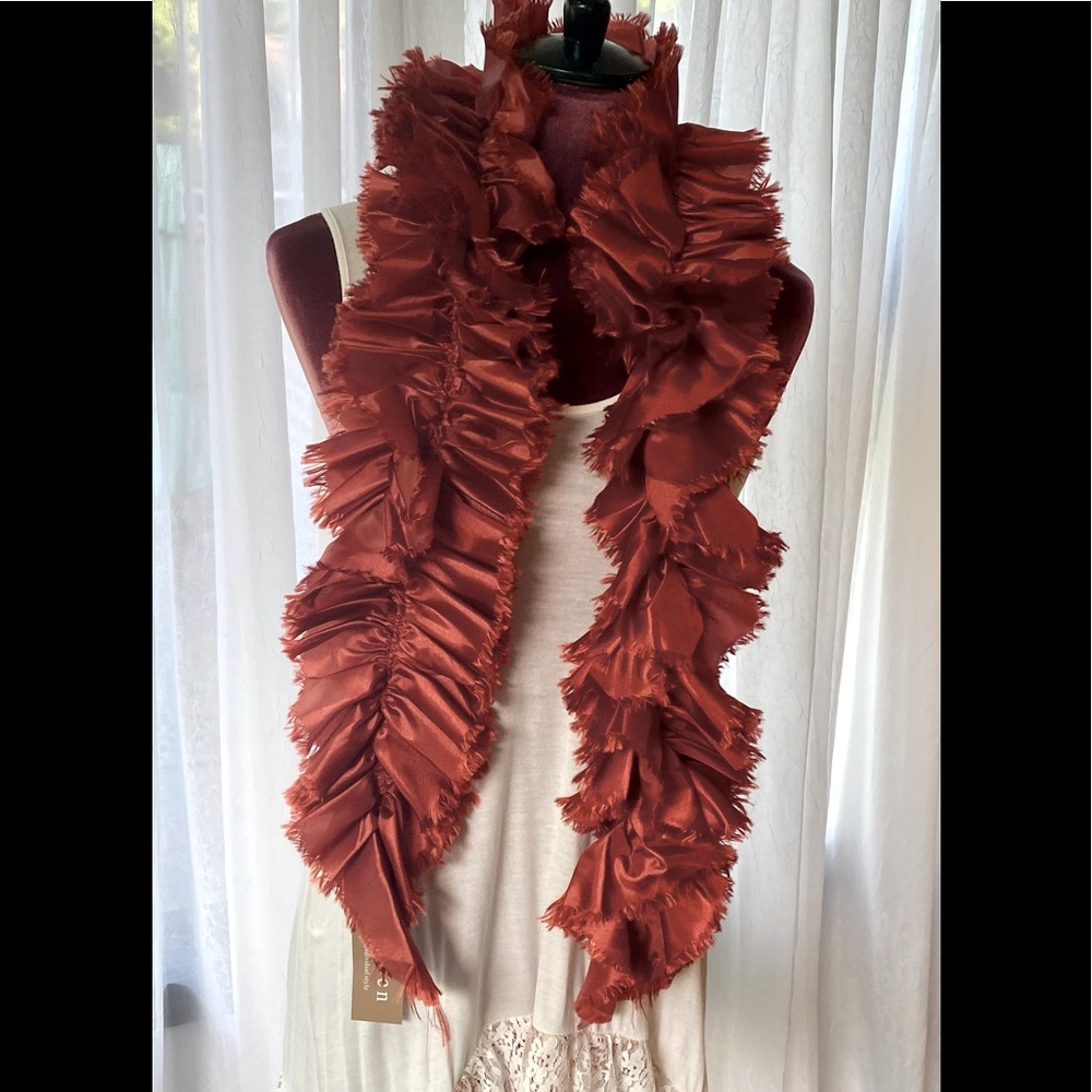 This is a silky feeling rusty clay colored boa scarf
